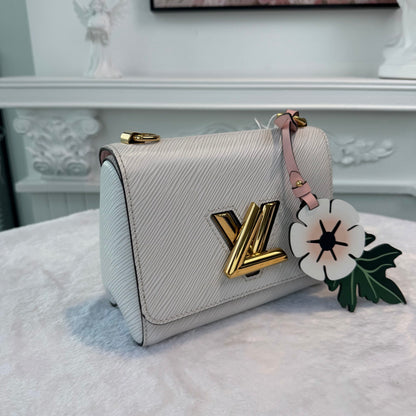 【#276】Pre-owned Louis Vuitton Twist MM Bag Epi Leather in White with Gold-Tone Hardware & Floral Bag Charm